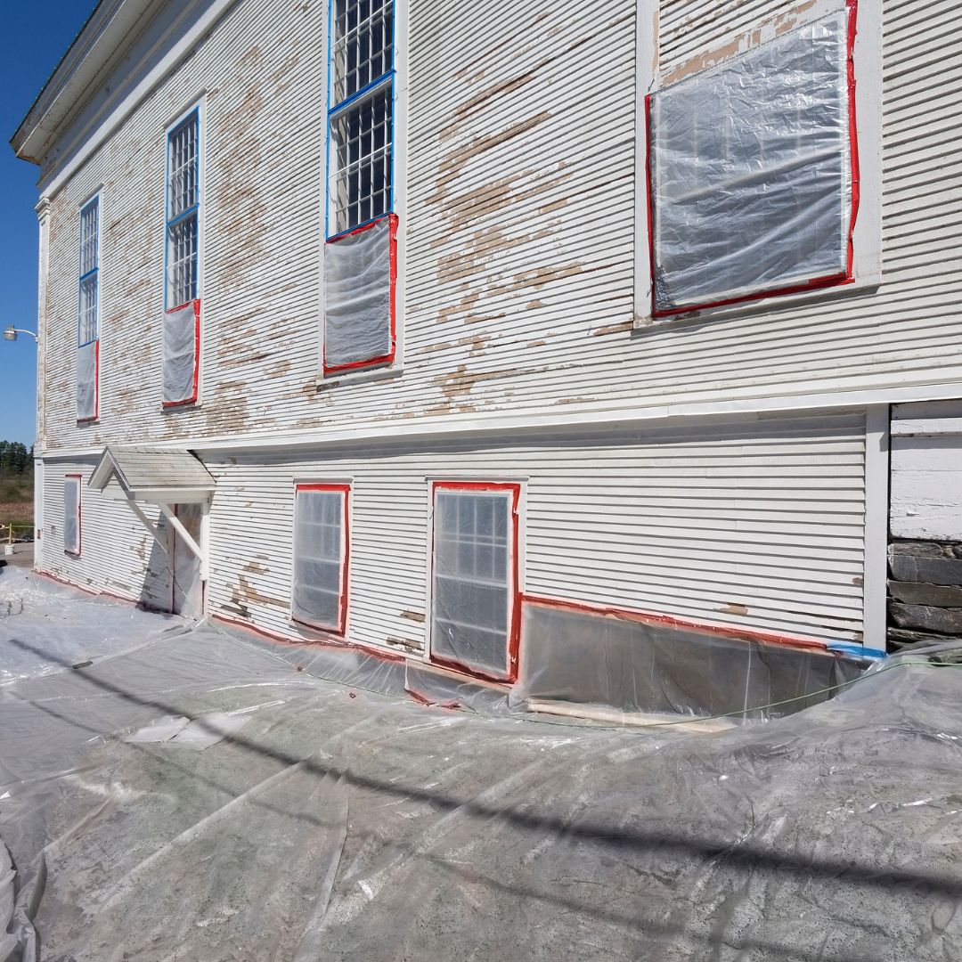 exterior of building with peeling white paint