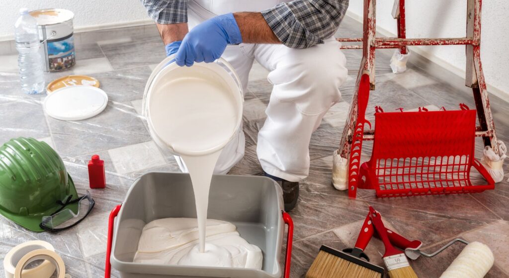 a person pouring paint