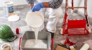 a person pouring paint