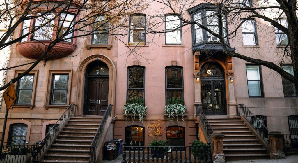 Exterior of a classic Brooklyn brownstone building under natural daylight.